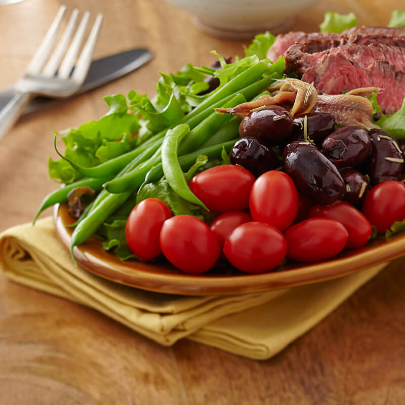 Grilled Steak and NatureSweet® Cherubs® Tomato Salad Nicoise